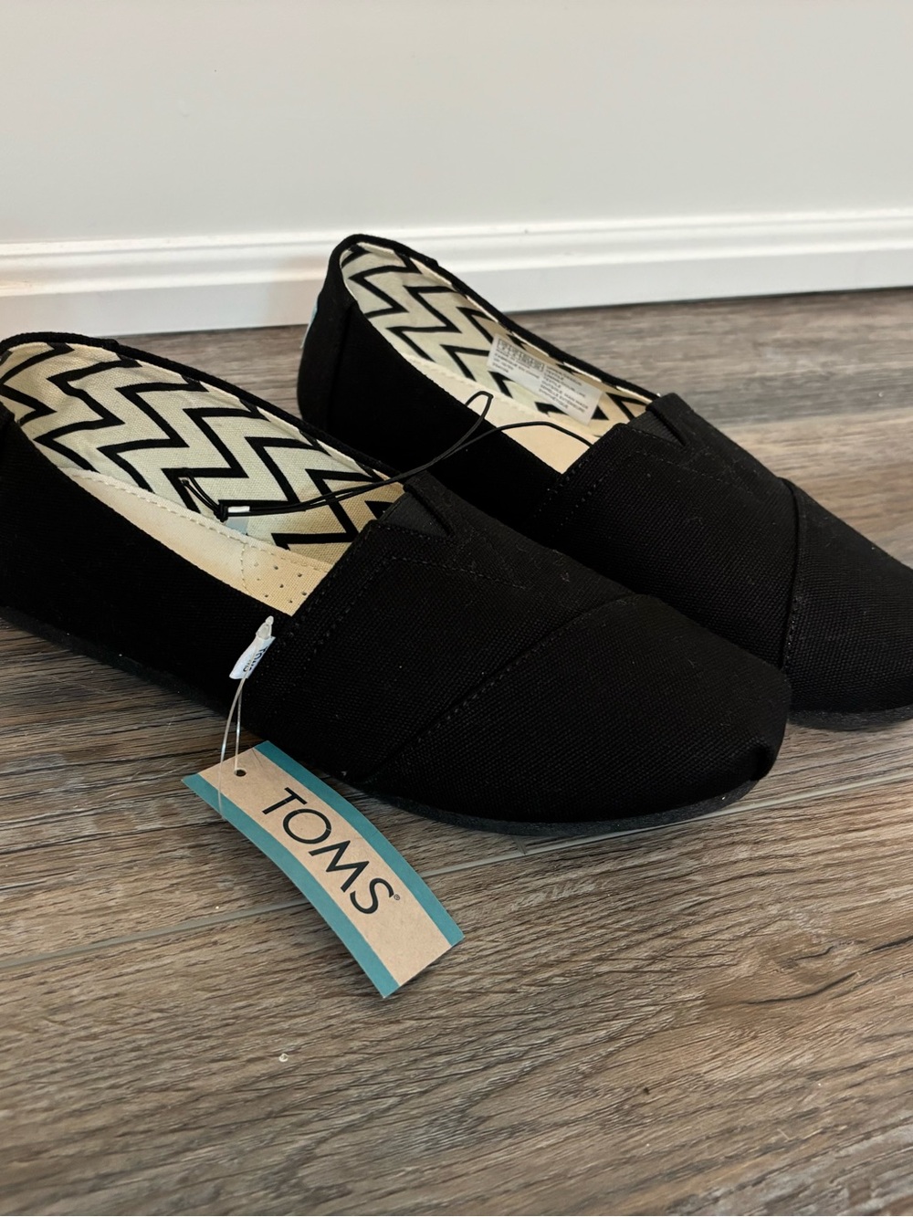 Toms Black Canvas Slip-On Flats with Zigzag Lining